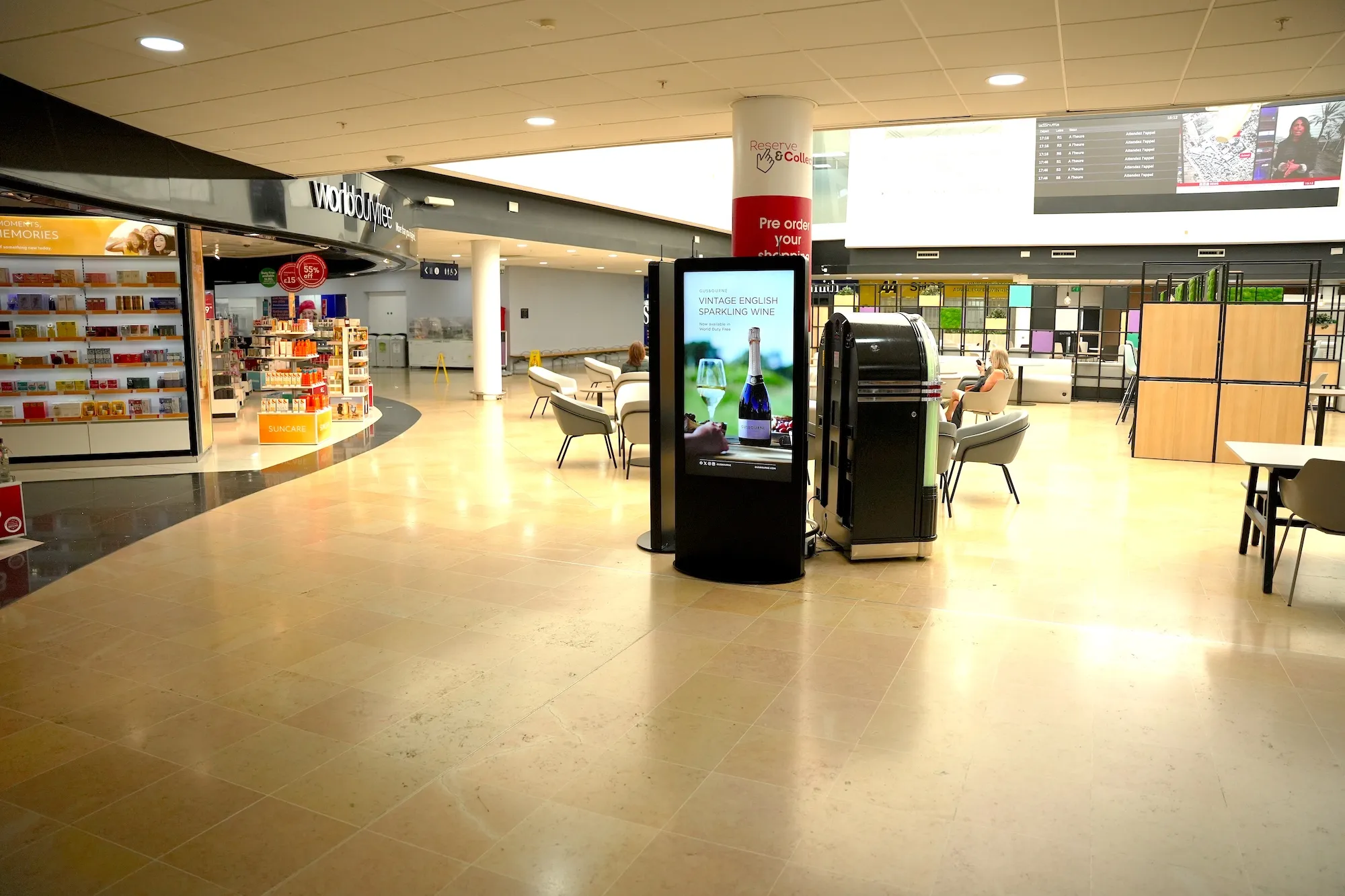 A digital advertising screen outside World Duty Free at the LeShuttle terminal