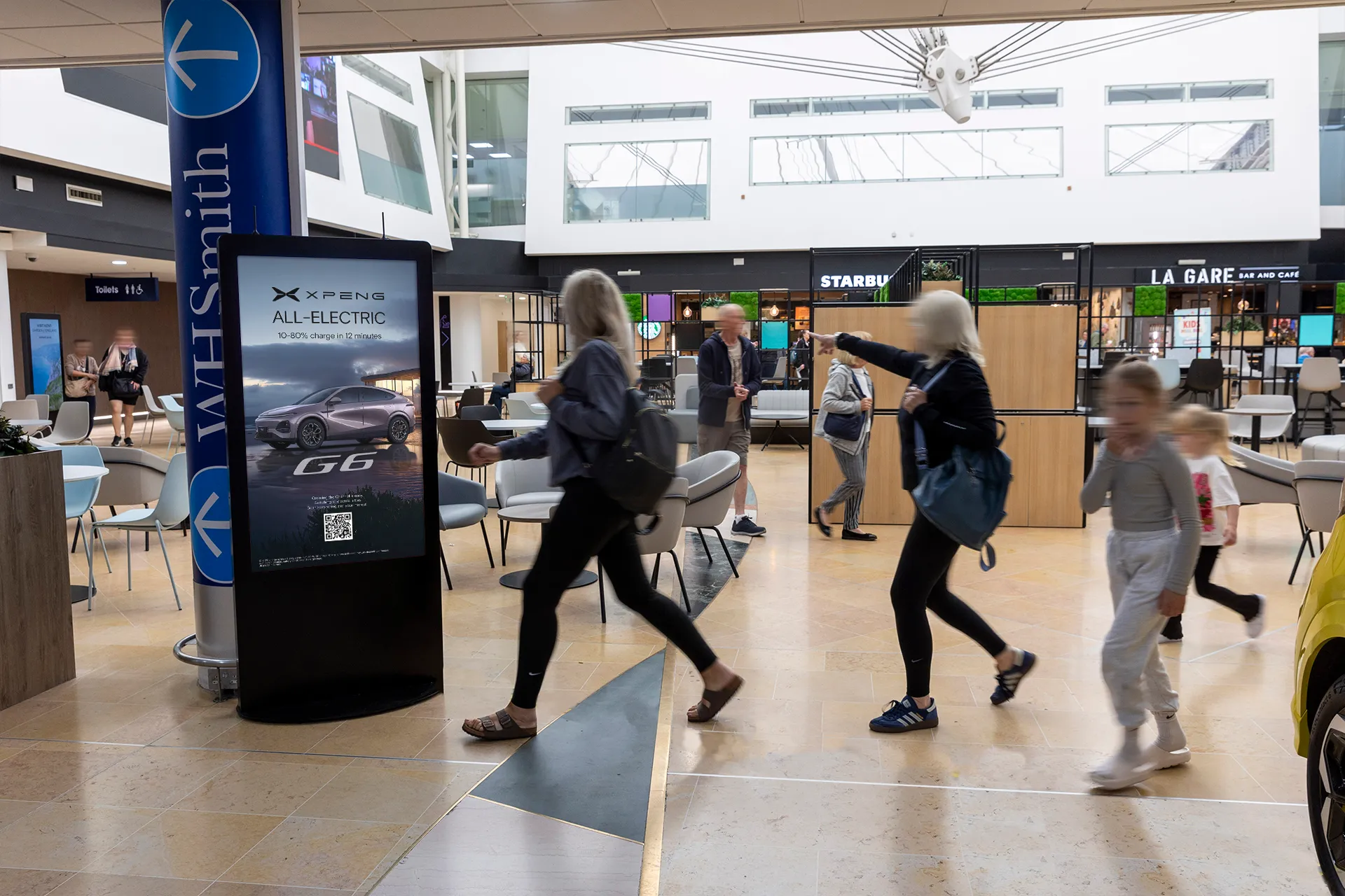 XPENG advertising on a D6 digital screen at LeShuttle
